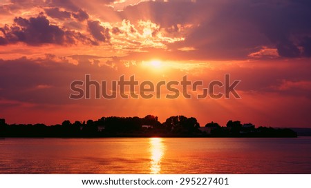 Retro Effect Of Summer Sunset With Beautiful Cloudy Sky Over Calm Lake Water