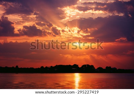Retro Effect Of Summer Sunset With Beautiful Cloudy Sky Over Calm Lake Water