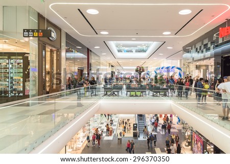 BUCHAREST, ROMANIA - JULY 14, 2015: People Crowd Rush In Shopping Luxury Mall Interior.