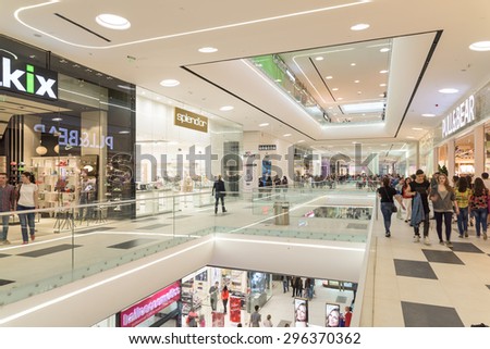 BUCHAREST, ROMANIA - JULY 14, 2015: People Crowd Rush In Shopping Luxury Mall Interior.