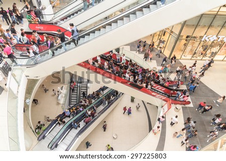 BUCHAREST, ROMANIA - JULY 16, 2015: People Crowd Rush In Shopping Luxury Mall Interior.