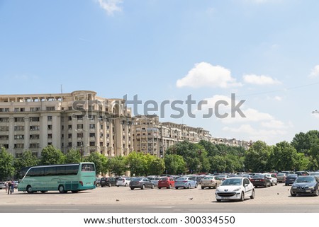 BUCHAREST, ROMANIA - JULY 26, 2015: Cars In Car Parking Lot In Front Of Parliament Palace (Casa Poporului) Or House Of The People In Bucharest.