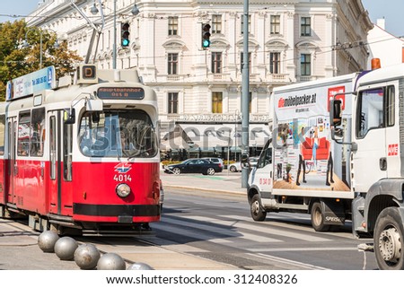VIENNA, AUSTRIA - AUGUST 05, 2015: People Waiting In Station For Modern Tram.
