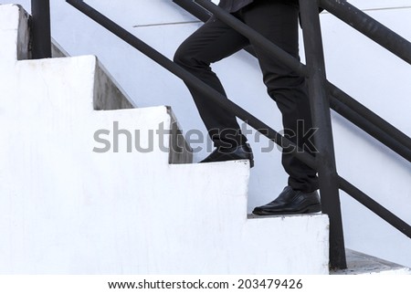 business man step up on stair, success,