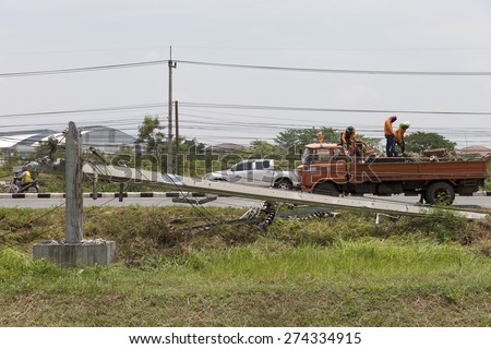 MUENG, MAHA SARAKHAM/THAILAND  MAY 2015: High voltage electricity post  damage besides highway due to heavy rain disaster on May 1, 2015 in Maha Sarakham. Storm occurred at night of April 30, 2015.