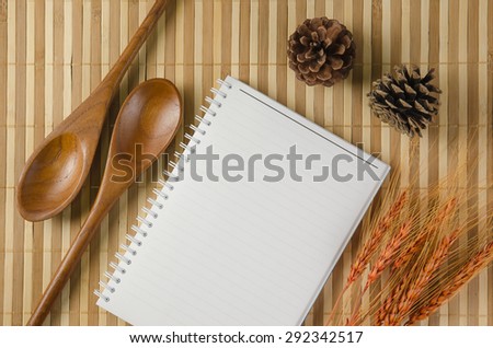 blank spiral notepad notebook on brown bamboo background