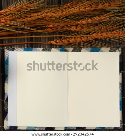 blank spiral notepad notebook on brown bamboo background