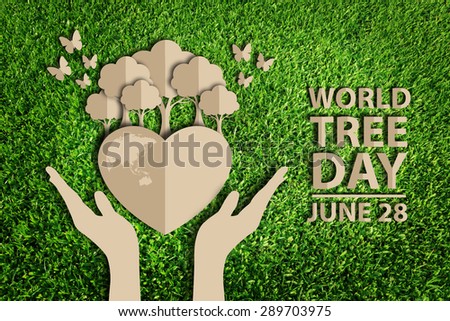Paper cut of World tree day concept on green grass
