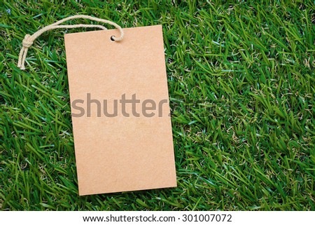 Price tags, labels on green grass background