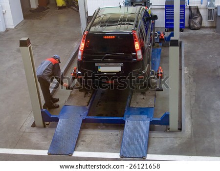 car on elevator service maintened by skilled professional serviceman workshop