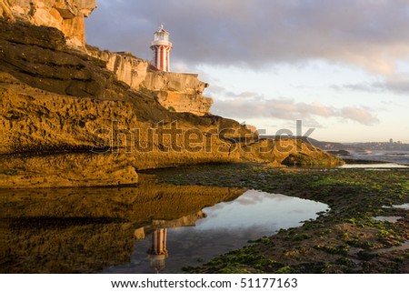 Lighthouse stays on top of cliff reflects in poll ocean coast sydney australia south head harbour entrance