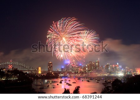 Sydney new year fireworks over CBD Harbour bridge color flash ball
