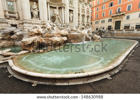 Italy Rome Fountain di Trevi close up view nobody blurred water from statues of gods baroque style european renaissance from marble and stone