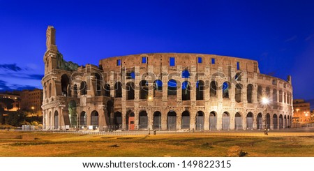 italy rome coliseum back panoramic view at sunrise blue sky illuminated archs and levels of this ancient roman emperor building national landmark