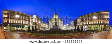 Italy Milan Central Square Panoramic View End To End With Cathedral In The Middle Facade And Wings Of Baroque Buildings Cityscape Landmark At Sunrise Under Blue Sky With Illuminated Lights