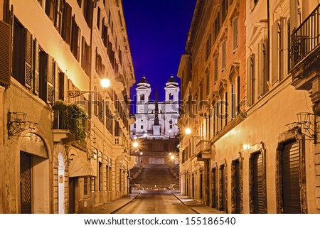 Italy ROme spanish steps square and street with shopping stores windows and brands at sunrise illuminated ancient capital city landmark