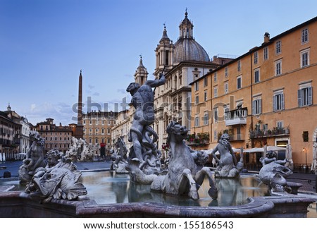 Italy Rome Piazza Navona square at sunrise landmark fountains and catholic church baroque art monuments blurred water four rivers and obelisk