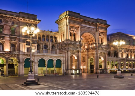 Italy Milan Vittorio Emmanuel Passage luxury shopping mall main gate entrance at sunrise fully illuminated