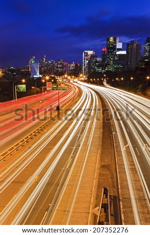 Australia Sydney Cahill expressway motorway vertical view at sunset with blurred vehicle headlights towards city CBD skyscrapers