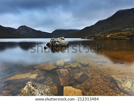 Australia Tasmania Cradle Mountain and DOve Lake national park bottom of the lake transparent pure water and stones within still reflection