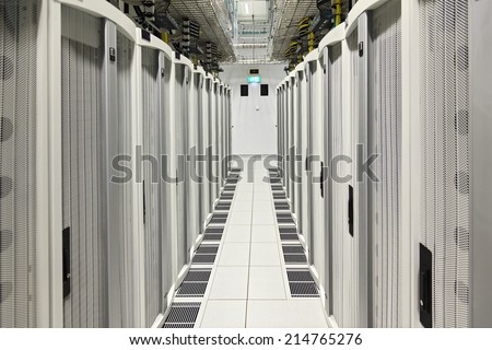 Global data center walkway between rack cabinets modern industrial IT world communications and internet