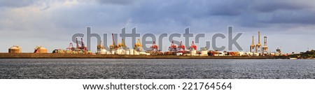 australia sydney botany bay cargo port panoramic view with cranes, containers, derricks and heavy dock equipment in a waterfront