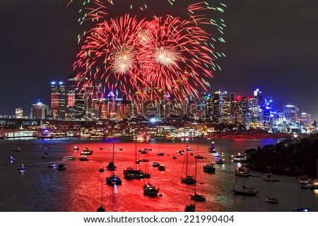 australia sydney city CBD close view at new year firewalls with red balls hanging over skyscrapers and reflecting in harbour water