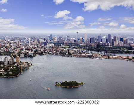 Australia NSW Sydney CBD and suburbs with harbour and small island aerial view from helicopter summer day time