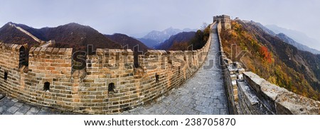 China The Great Wall panoramic view on top of mountains brick wall segment in autumn with yellow trees