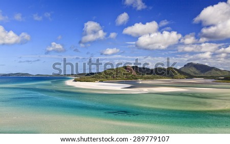 Secluded pristine shallow lagoon of white silica sand and transparent water form part of coral sea around WHitsunday group of islands in Great Barrier reef