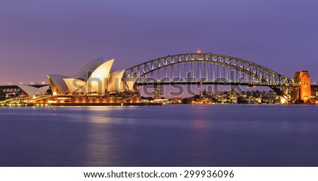 SYDNEY, AUSTRALIA, 10 JULY 2015 - Sydney opera house and Harbour bridge in SYdney at sunset. Iconic and world famous landmark of Australia viewed from Mrs Macquary point in Royal Botanic Garden