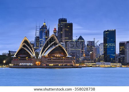 Sydney city CBD landmarks at blue sunset as seen from Kirribilli over harbour