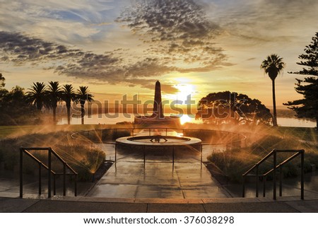 front view of fallen soldiers memorial in Kings park of Perth , capital of Western Australia. Rising sun litting fountains and obelisk
