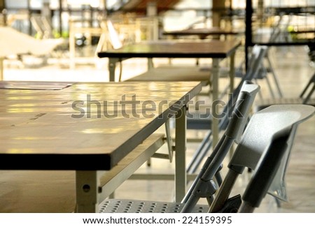 Empty chairs on outdoor classroom in school