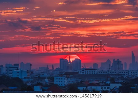 Picture of the sunset on the back tall buildings in Bangkok, Thailand.