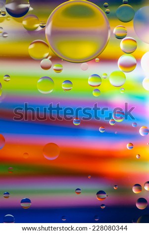 Rainbow circle bubbles on a beautiful colorful background.