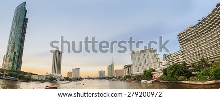 Panorama area ,river with building  architecture style modern ,business area in evening