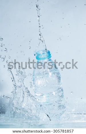 Bottle of drinking water splash out a water distribution