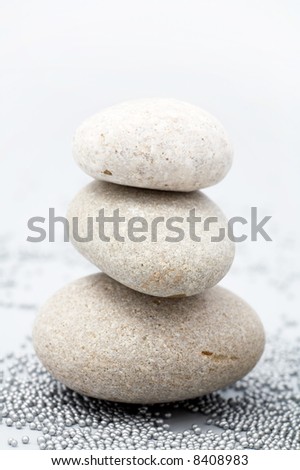 pile of river stones and small grey balls