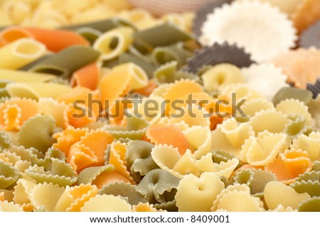 assorted colorful uncooked pasta as background