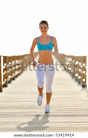 young woman jogging outdoor in summer