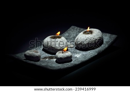burning candles isolated on black background