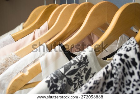 row of white dress in wardrobe at home