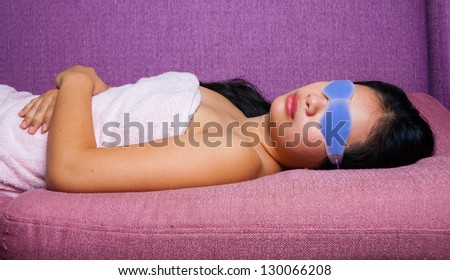 Cute Asian-Thai Girl with eyes gel mask which covering the upper part of the face but with holes for the eyes