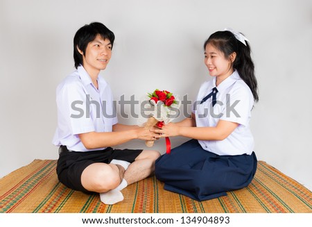 Boyfriend gives flower to girlfriend