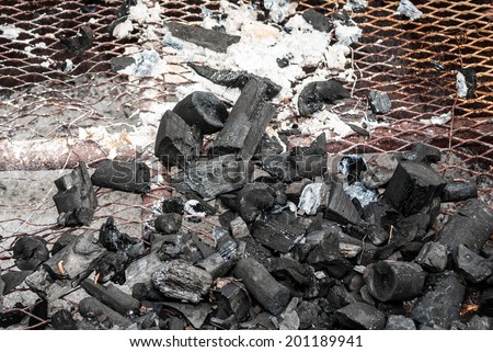 Wood Coal with Ash on Grate.