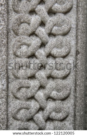 Celtic knot carved in stone in close up