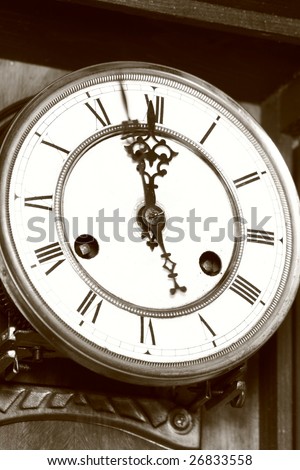 Old clock at almost twelve o'clock