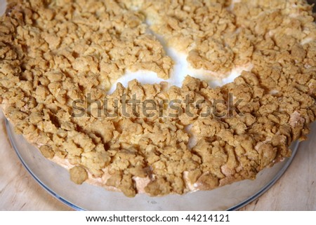 Pie in baking tin -  foam made of whipped egg whites covered with crumble
