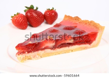 Piece of Strawberry Tart on a white plate decorated with strawberries